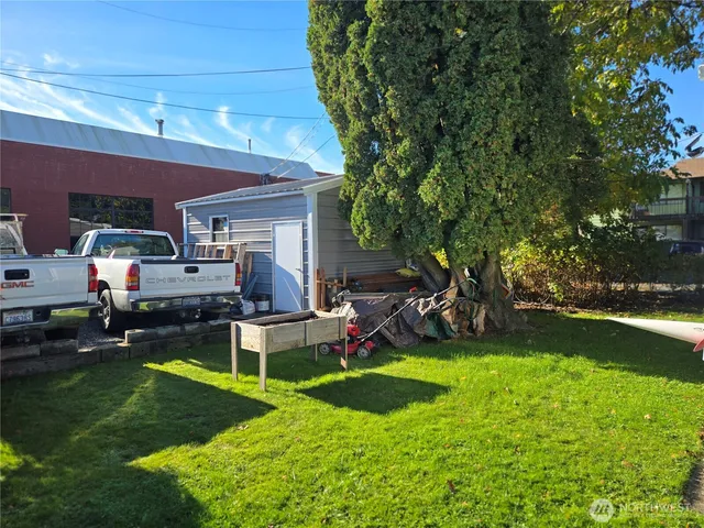 a front view of a house with a garden and deck
