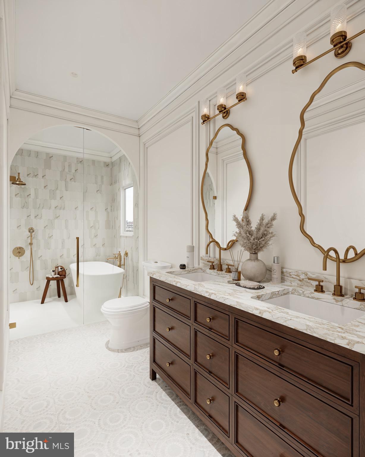 228 11th Street Northeast Washington, DC 20002 - Photo 2 of 3 a en suite bathroom with double vanity sinks and a mirror