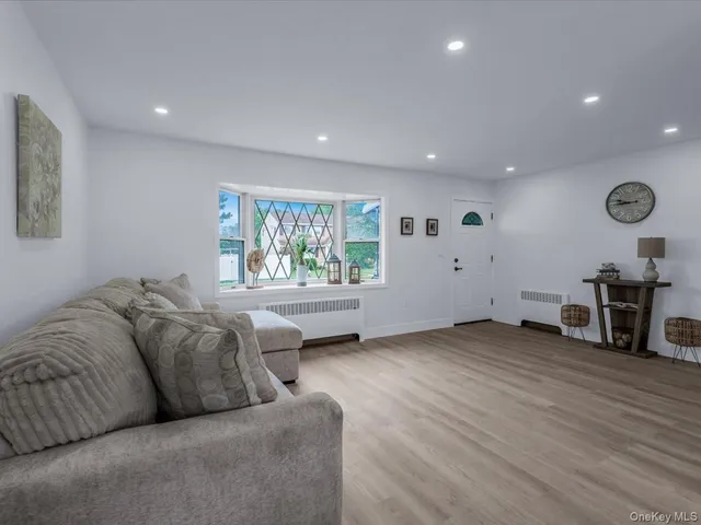 a living room with furniture and a window