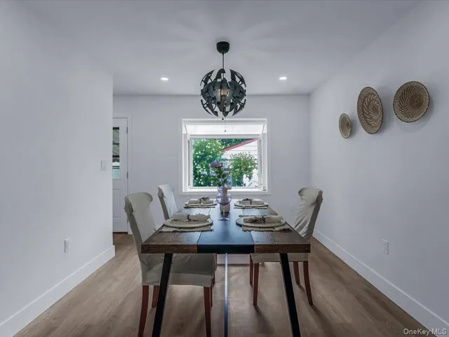 a dining room with furniture and window