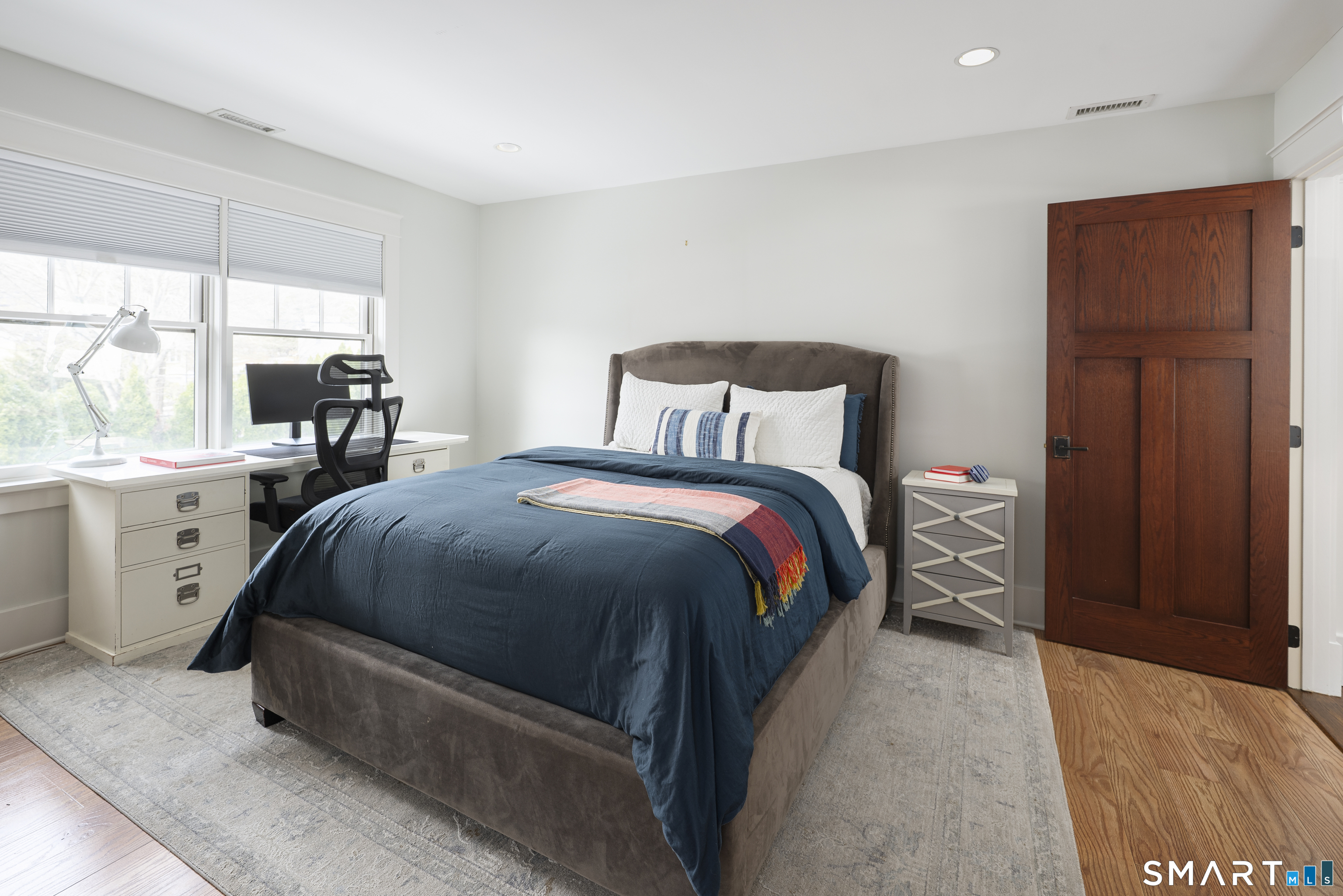 107 Parade Hill Road New Canaan, CT 06840 - Photo 13 of 28 a bed room with a bed and a dresser