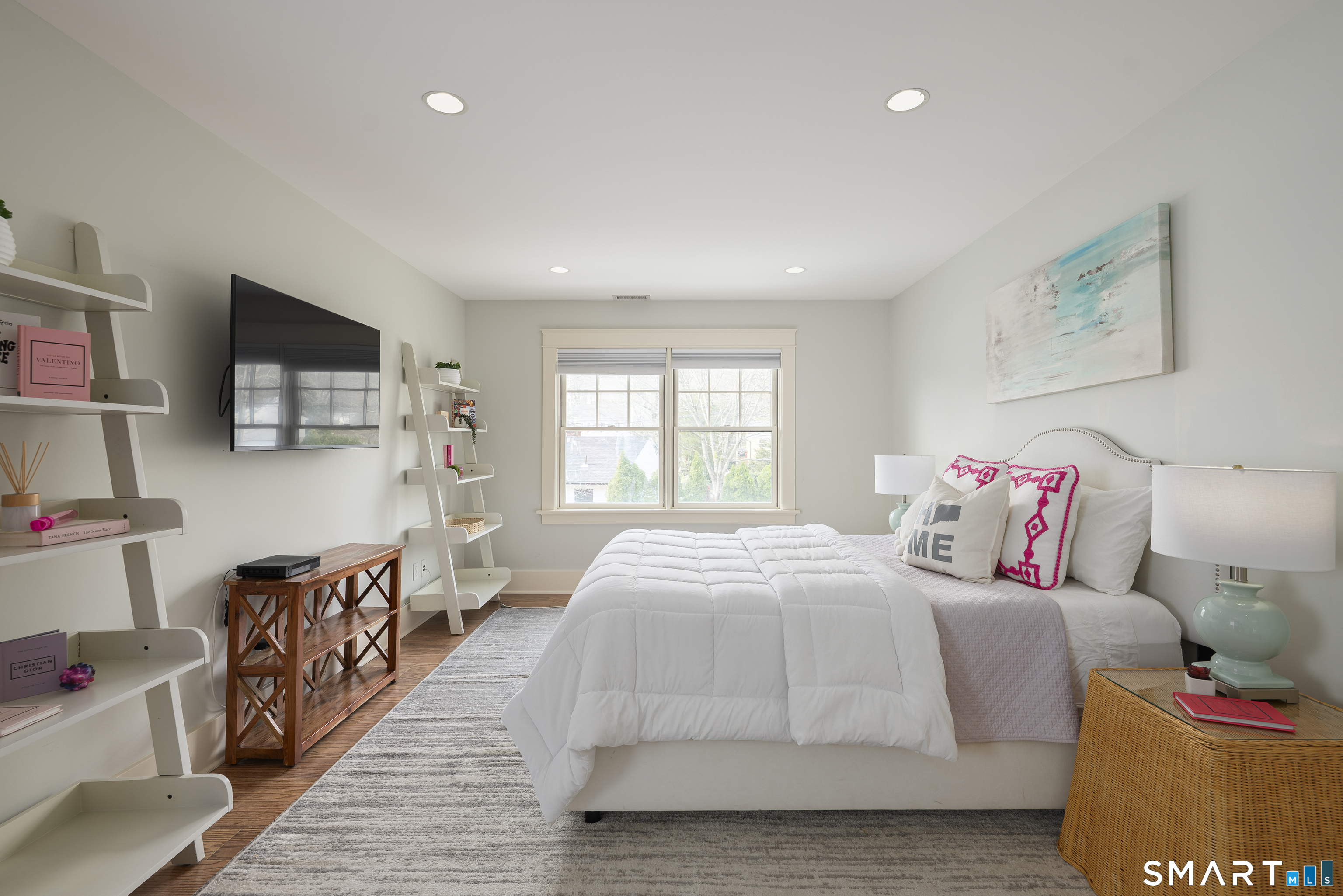 107 Parade Hill Road New Canaan, CT 06840 - Photo 14 of 28 a bedroom with a bed and wooden floor