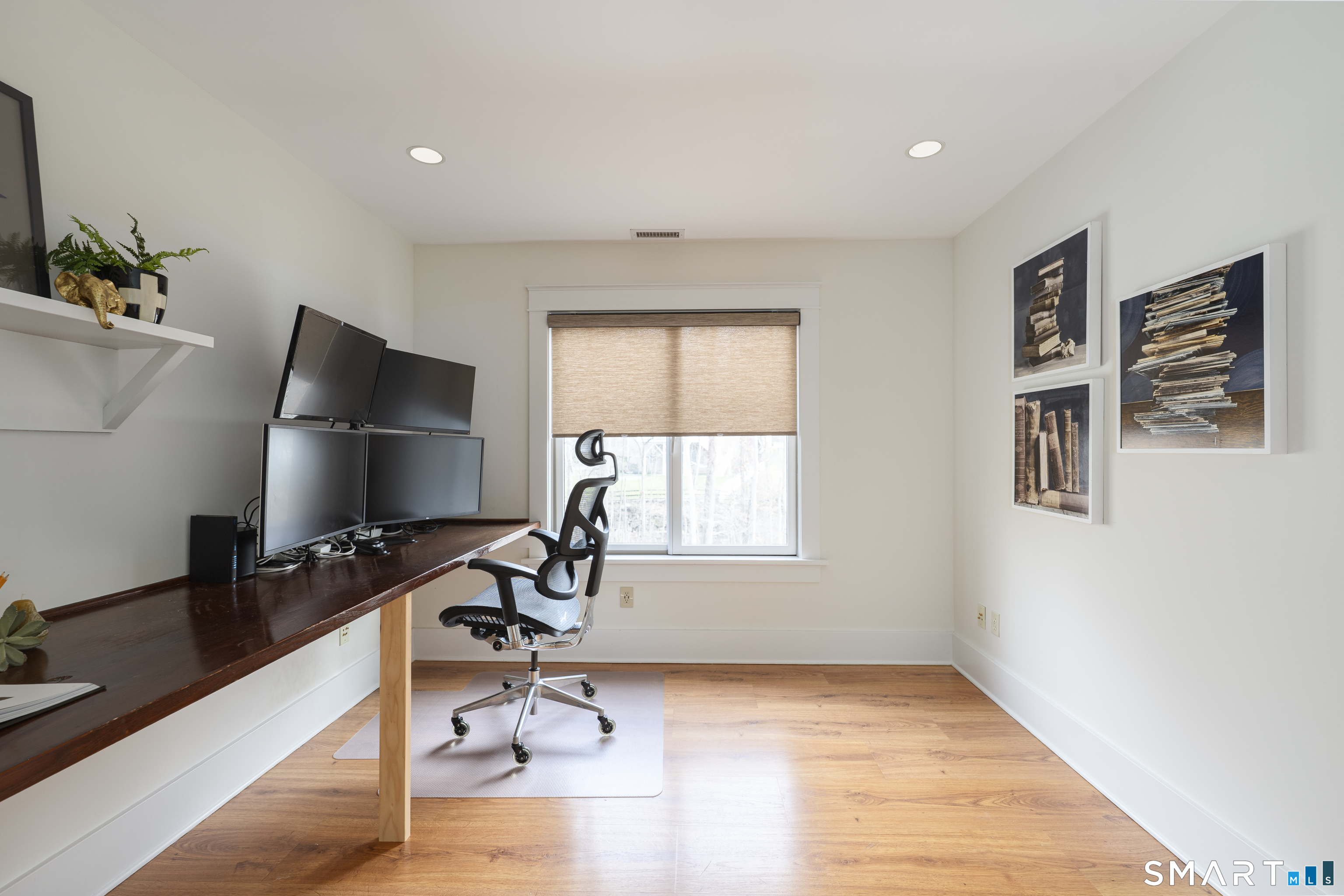 107 Parade Hill Road New Canaan, CT 06840 - Photo 16 of 28 a view of a workspace with furniture and a window
