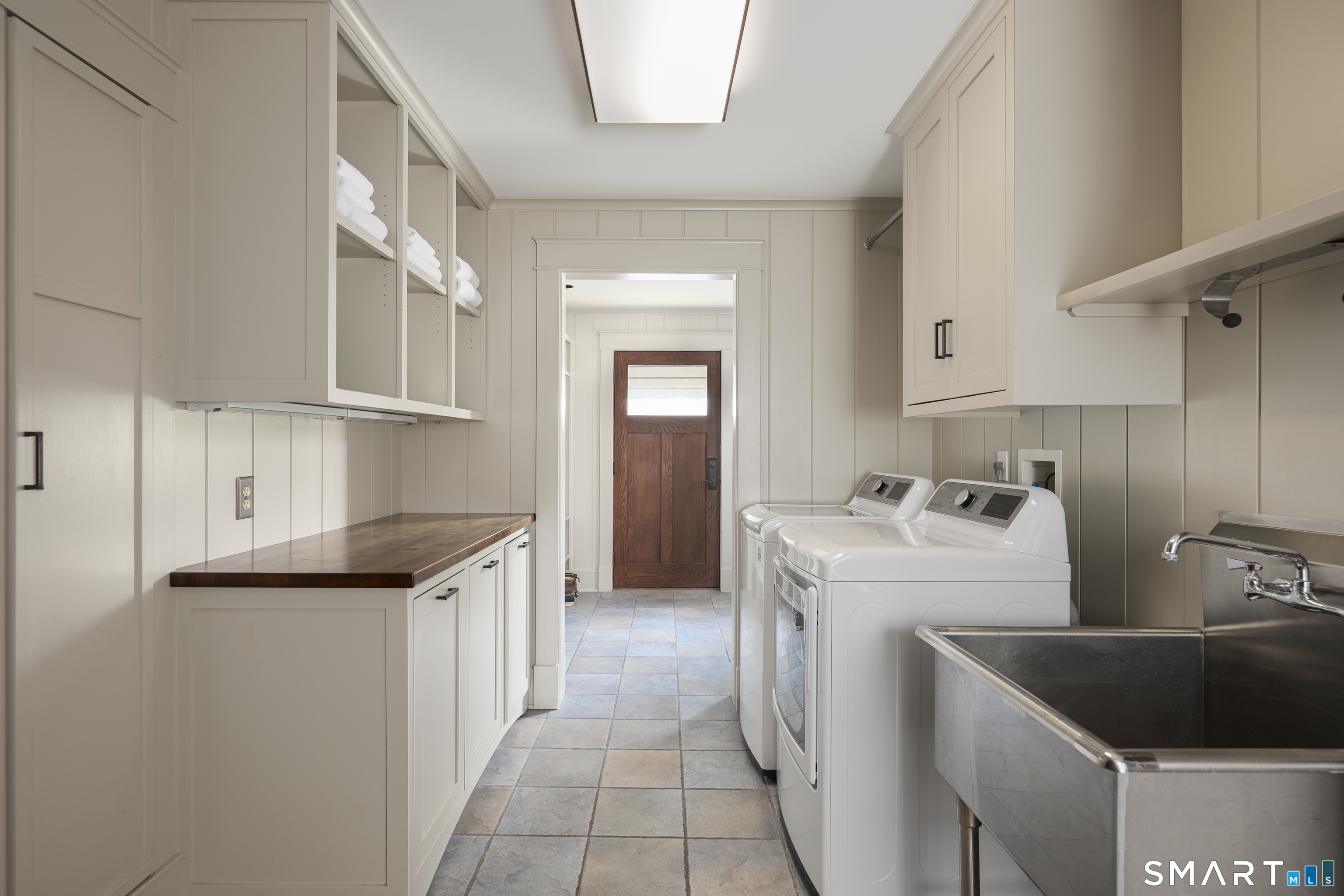 107 Parade Hill Road New Canaan, CT 06840 - Photo 19 of 28 a kitchen with a sink and cabinets