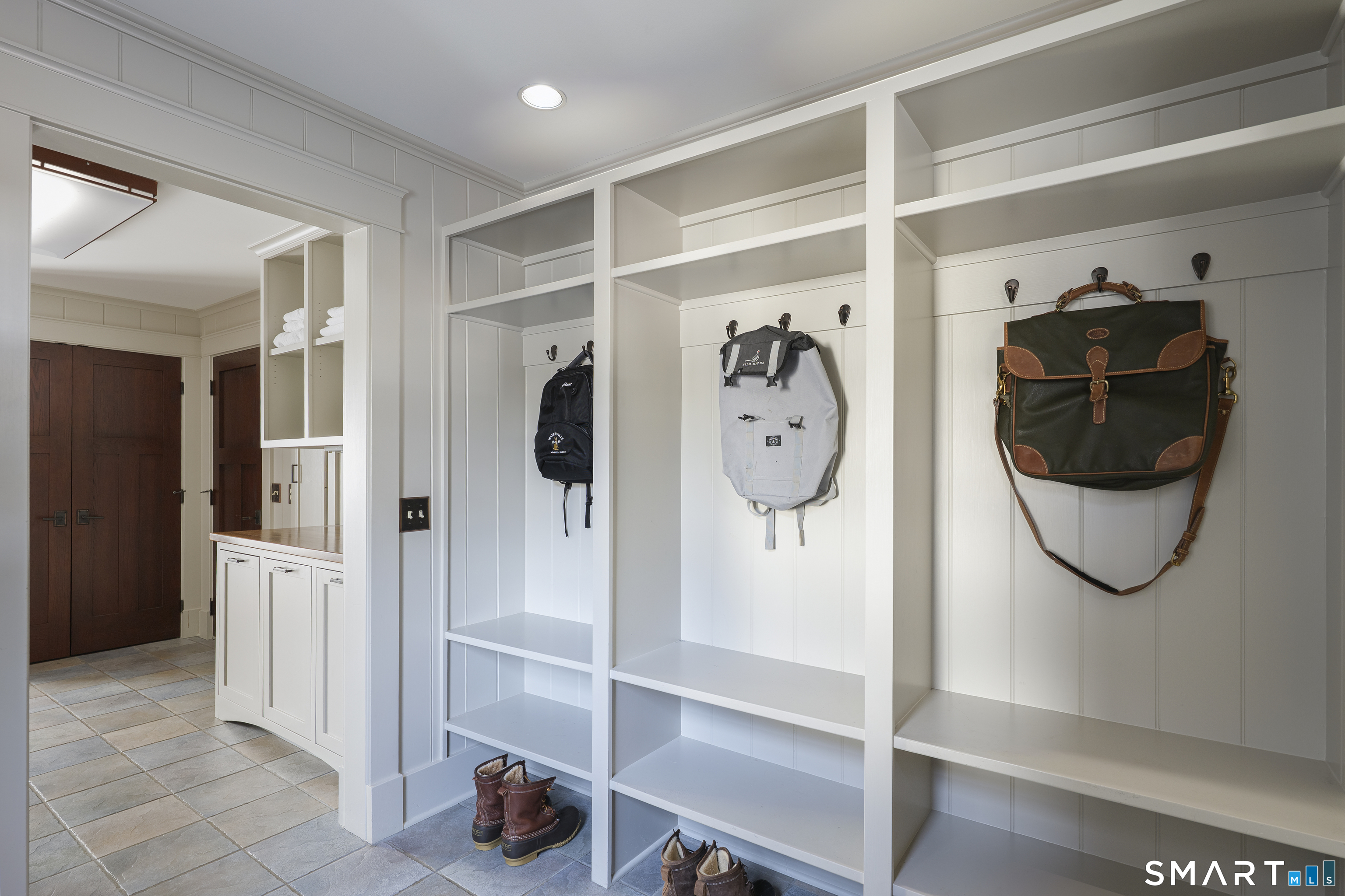 107 Parade Hill Road New Canaan, CT 06840 - Photo 20 of 28 a view of walk in closet with clothes and shoes