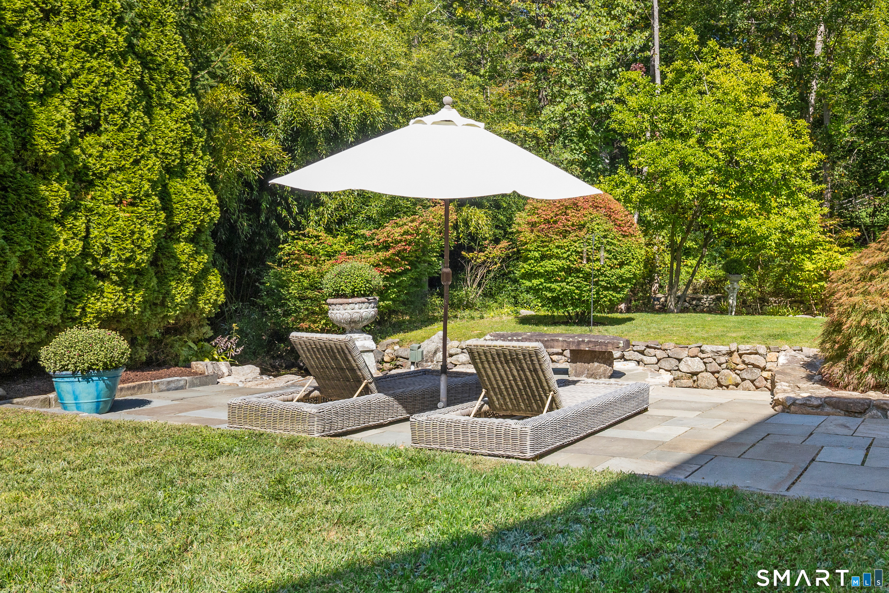 107 Parade Hill Road New Canaan, CT 06840 - Photo 21 of 28 a view of backyard with seating area and green space