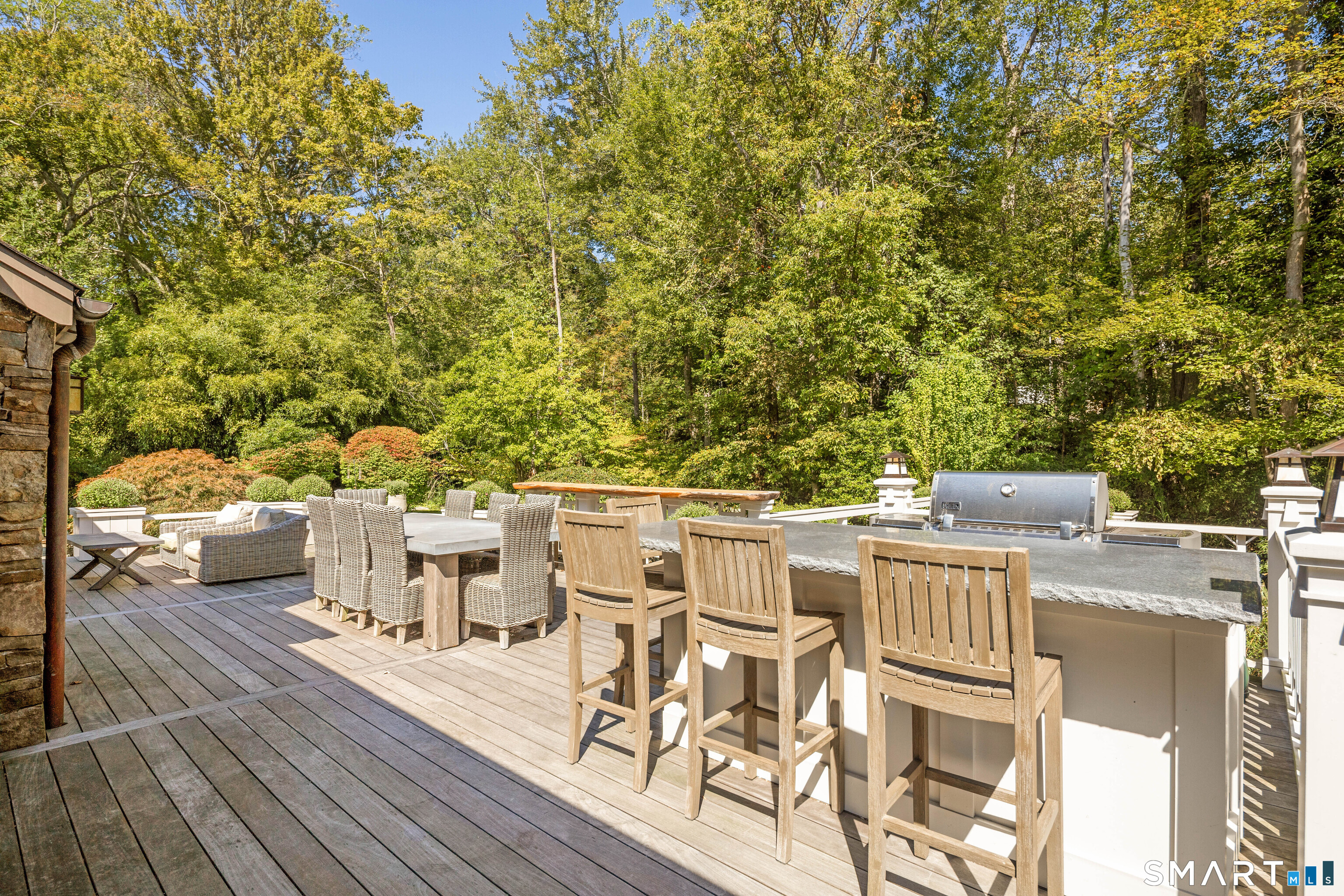 107 Parade Hill Road New Canaan, CT 06840 - Photo 23 of 28 a view of a patio with table and chairs with wooden floor