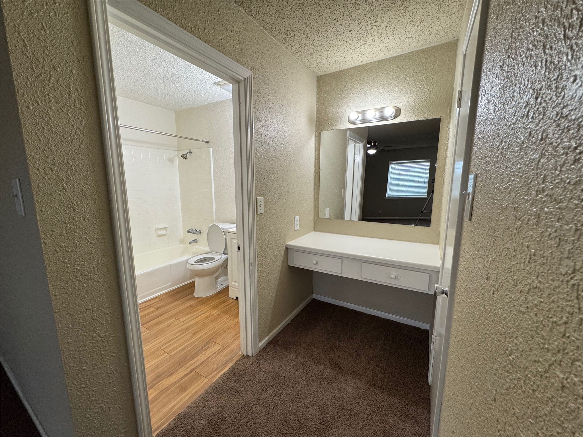 4904 West Wind Trail, Unit 101 Austin, TX 78745 - Photo 12 of 18 a bathroom with a sink and a mirror