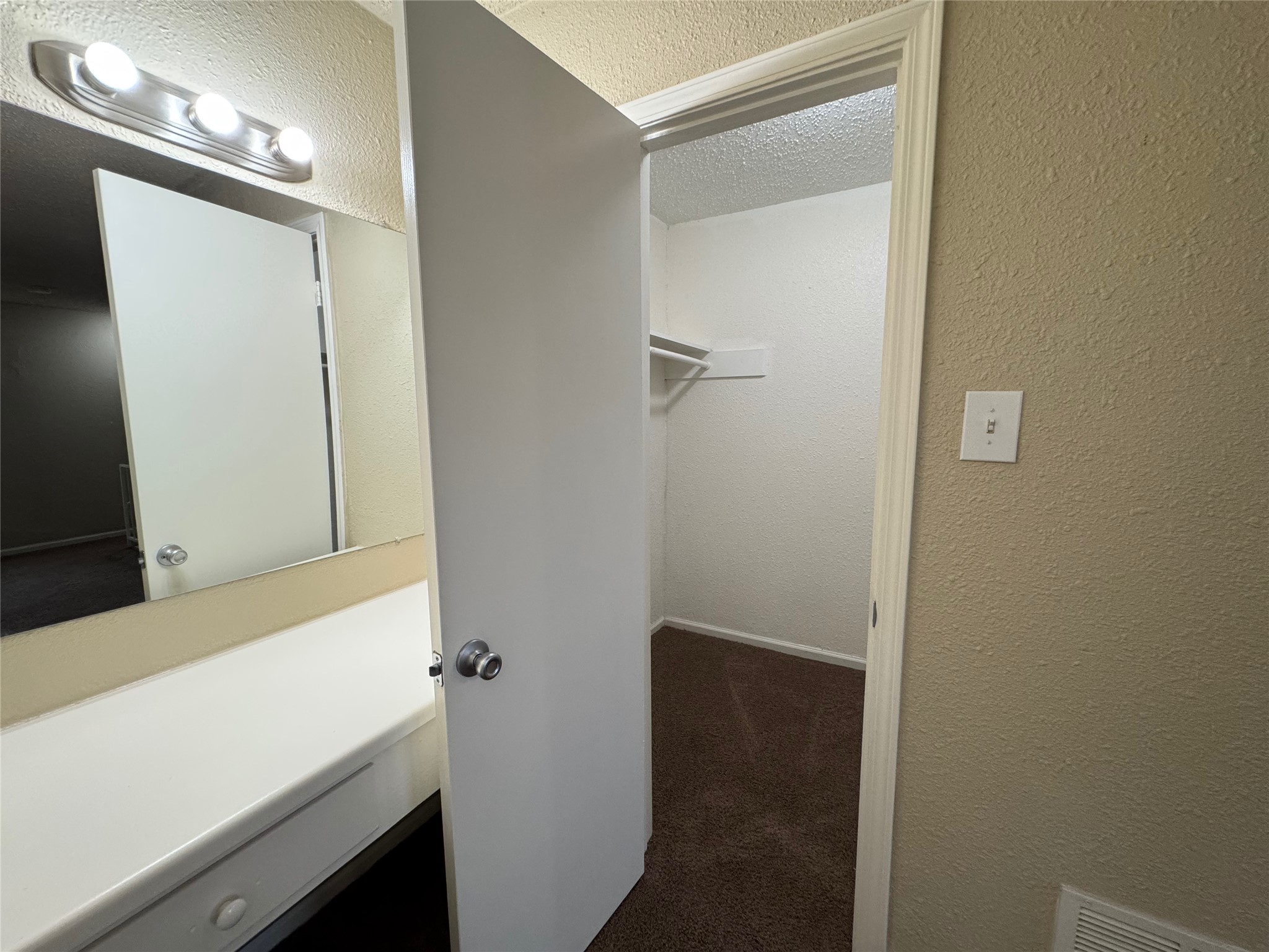 4904 West Wind Trail, Unit 101 Austin, TX 78745 - Photo 13 of 18 a bathroom with a sink and a mirror