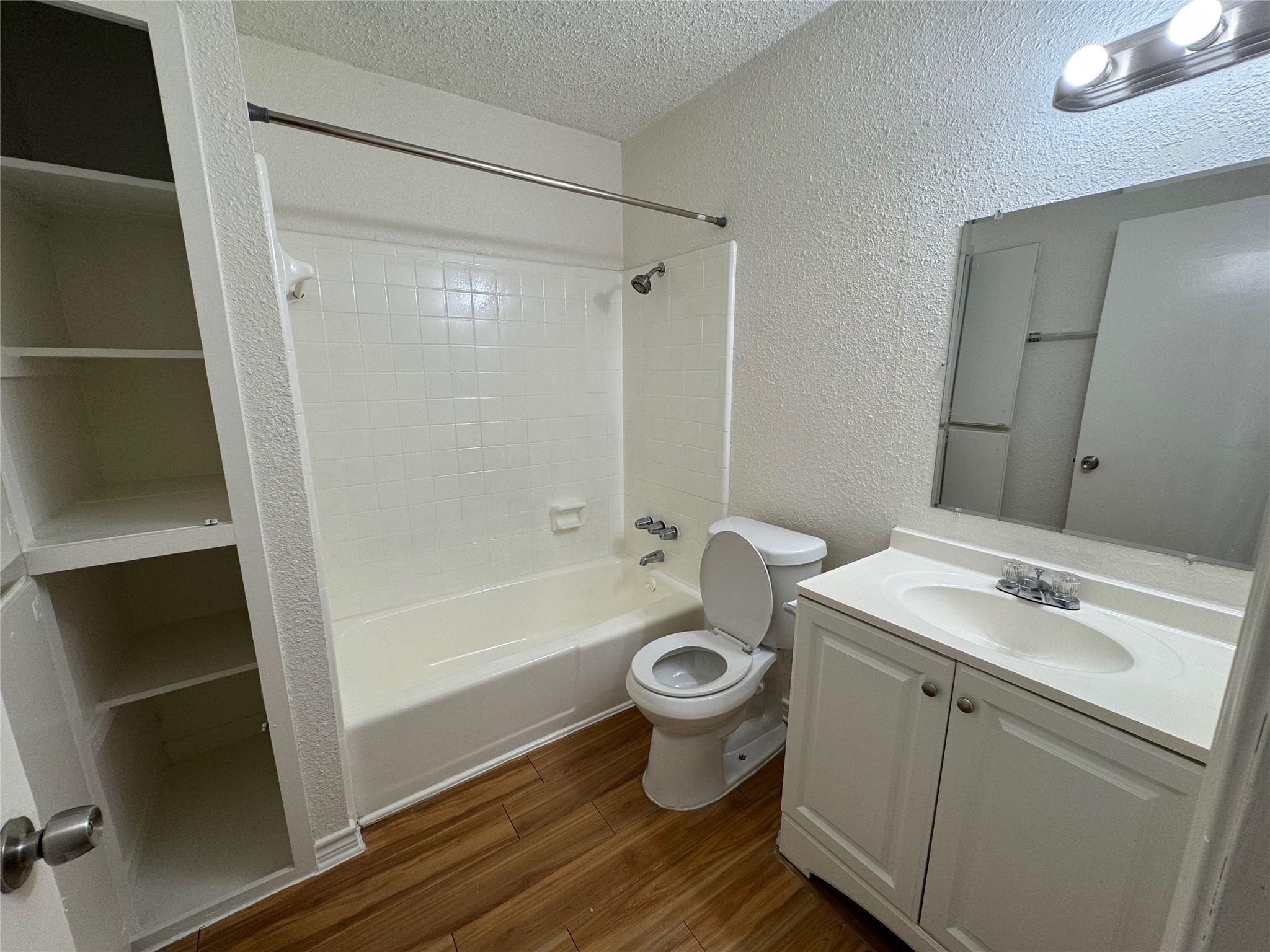 4904 West Wind Trail, Unit 101 Austin, TX 78745 - Photo 14 of 18 a bathroom with a sink toilet and shower