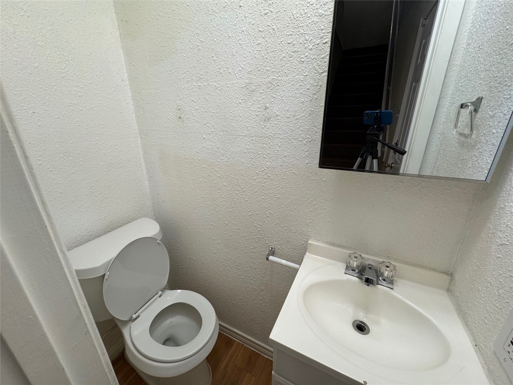4904 West Wind Trail, Unit 101 Austin, TX 78745 - Photo 7 of 18 a bathroom with a sink and a toilet