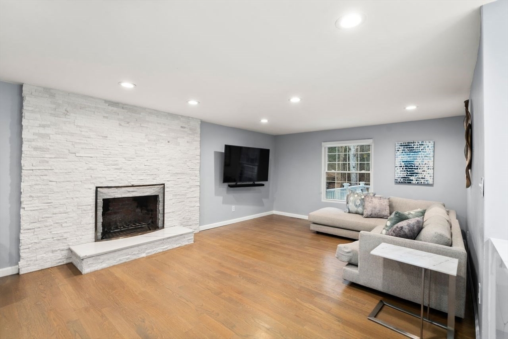 52 Condor Road Sharon, MA 02067 - Photo 11 of 36 a living room with furniture and a fireplace