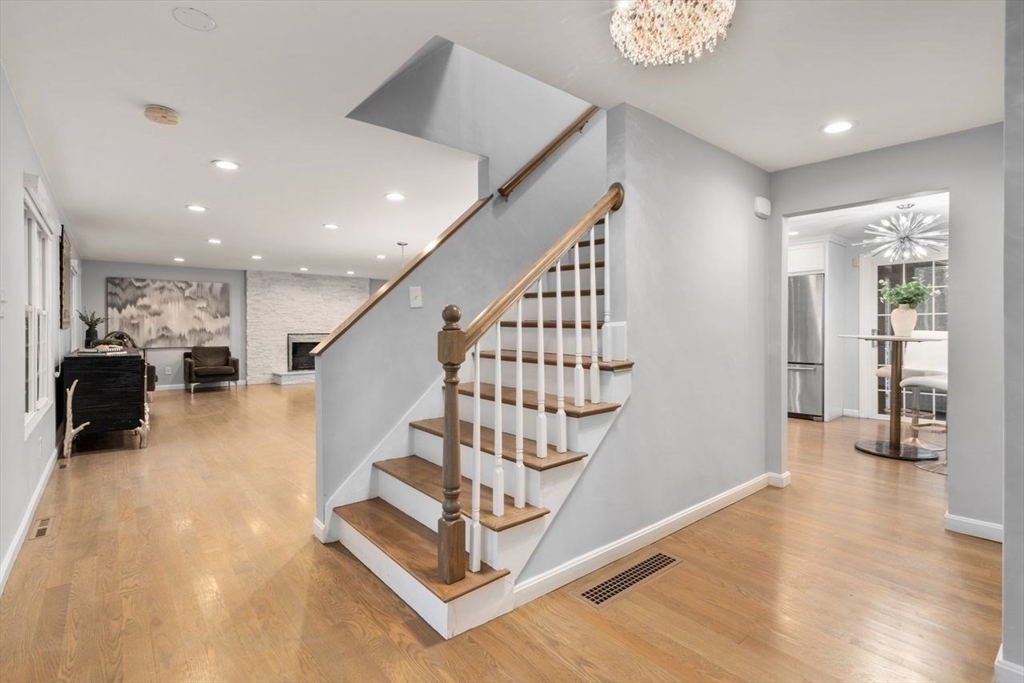 52 Condor Road Sharon, MA 02067 - Photo 15 of 36 a view of entryway and hall with wooden floor