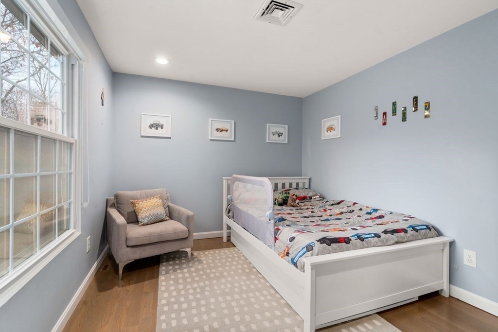 52 Condor Road Sharon, MA 02067 - Photo 24 of 36 a bedroom with a bed and a couch