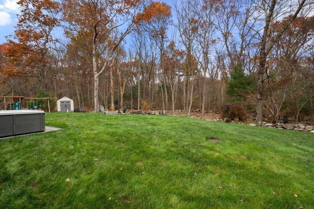 52 Condor Road Sharon, MA 02067 - Photo 28 of 36 a view of a park with large trees