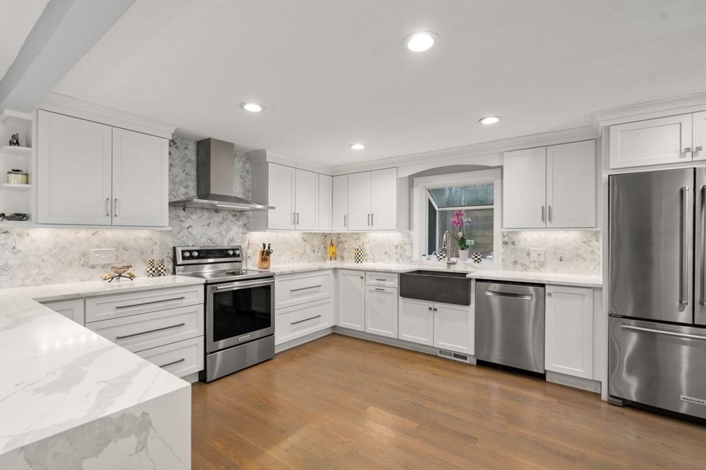 52 Condor Road Sharon, MA 02067 - Photo 5 of 36 a kitchen with a refrigerator stove top oven and sink
