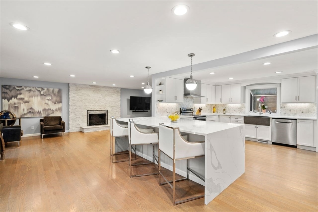 52 Condor Road Sharon, MA 02067 - Photo 8 of 36 a large white kitchen with lots of counter space and furniture