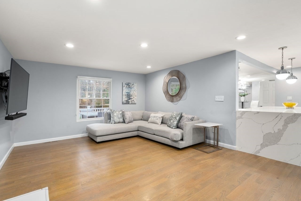 52 Condor Road Sharon, MA 02067 - Photo 10 of 36 a living room with furniture and a large window