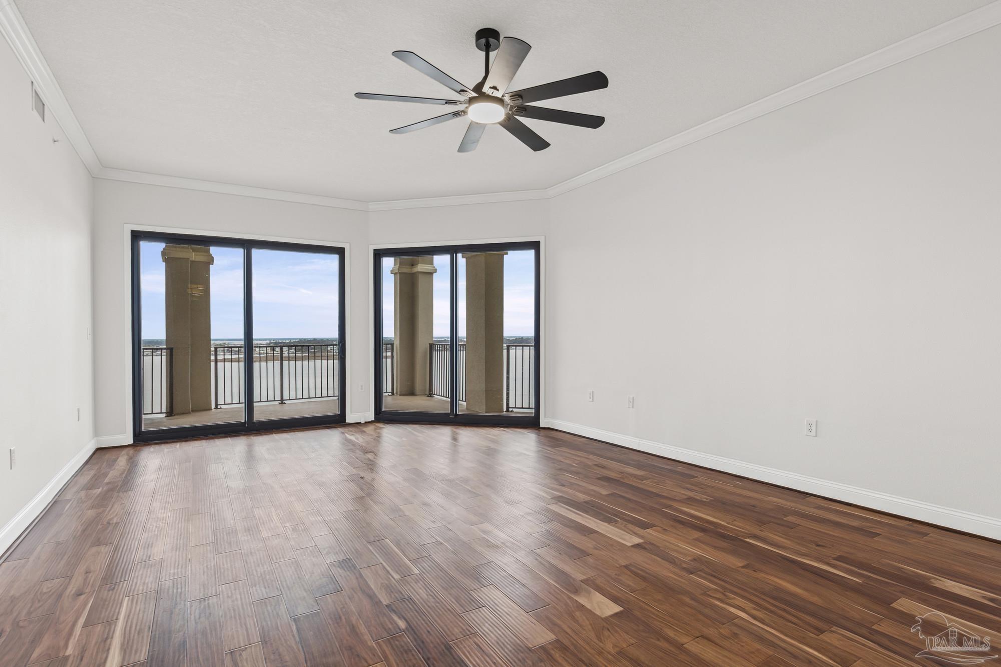 14900 River Road, Unit 904 Perdido Key, FL 32507 - Photo 22 of 62 a view of an empty room with a window and wooden floor
