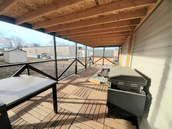 a view of a chairs and table in the balcony