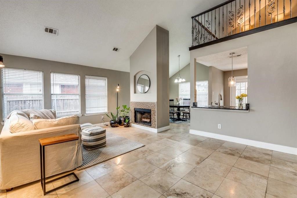 8164 Heritage Pl Drive Fort Worth, TX 76137 - Photo 3 of 8 a view of a livingroom with furniture and a fireplace