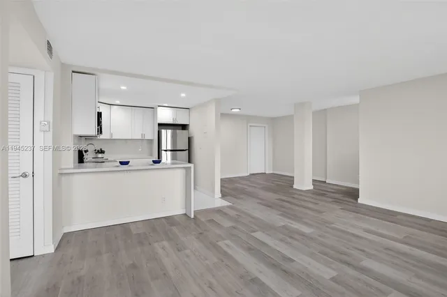 a view of kitchen with wooden floor