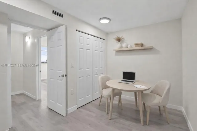 a view of a workspace with furniture