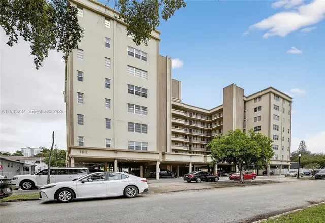 a city street lined with buildings and cars