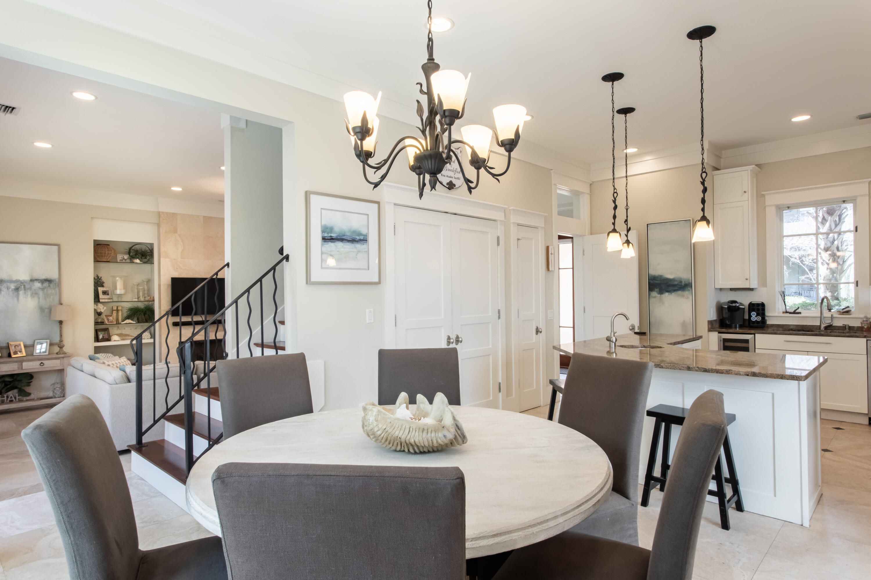 175 Rue Martine Miramar Beach, FL 32550 - Photo 11 of 23 a view of a dining room with furniture wooden floor and chandelier