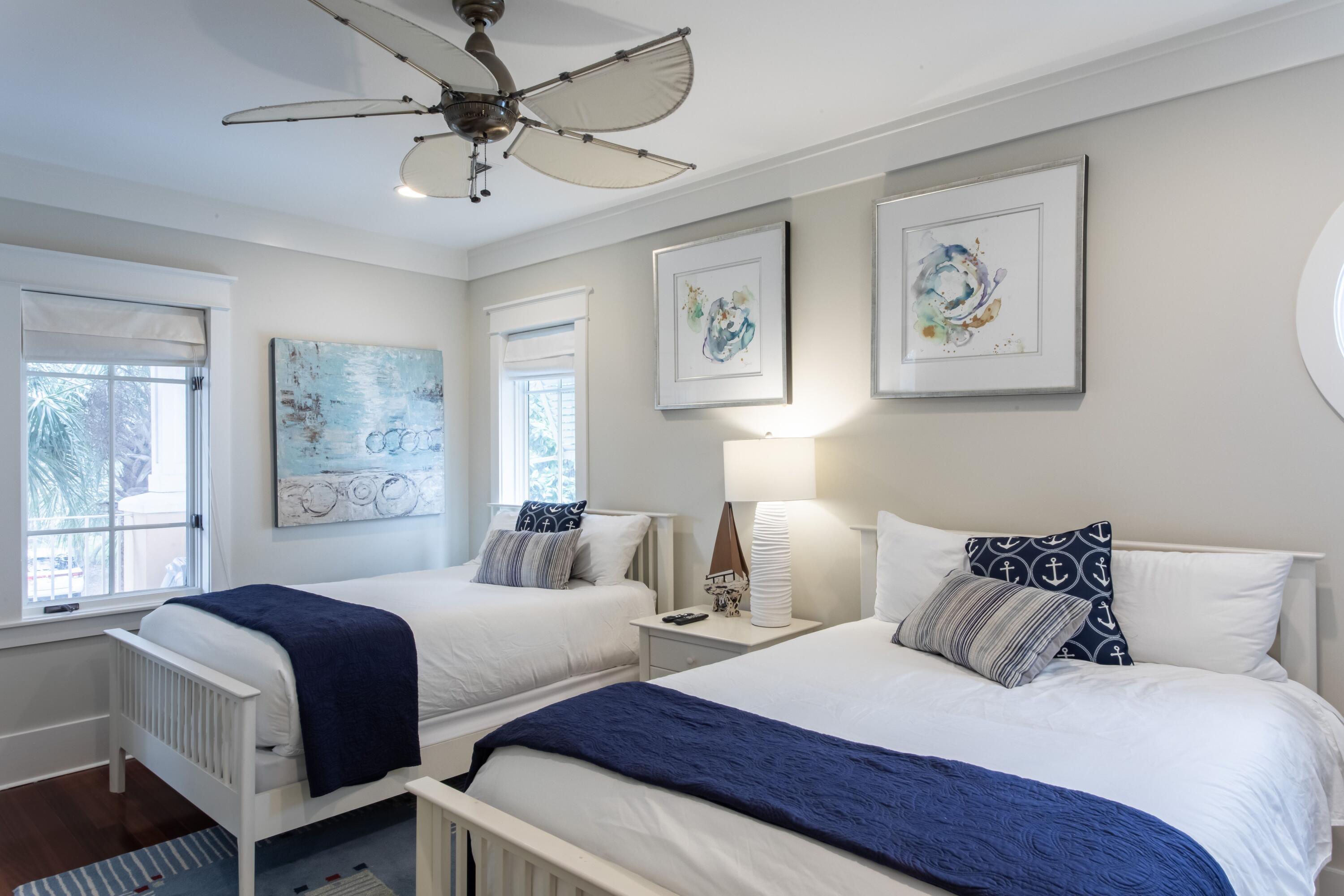 175 Rue Martine Miramar Beach, FL 32550 - Photo 17 of 23 a bedroom with two beds and a large window