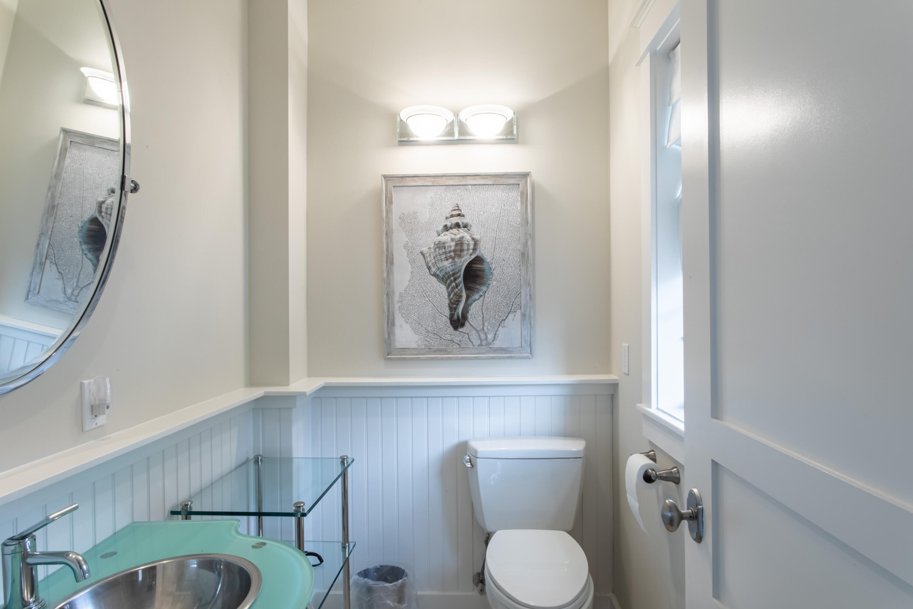 175 Rue Martine Miramar Beach, FL 32550 - Photo 19 of 23 a bathroom with a toilet a sink and mirror