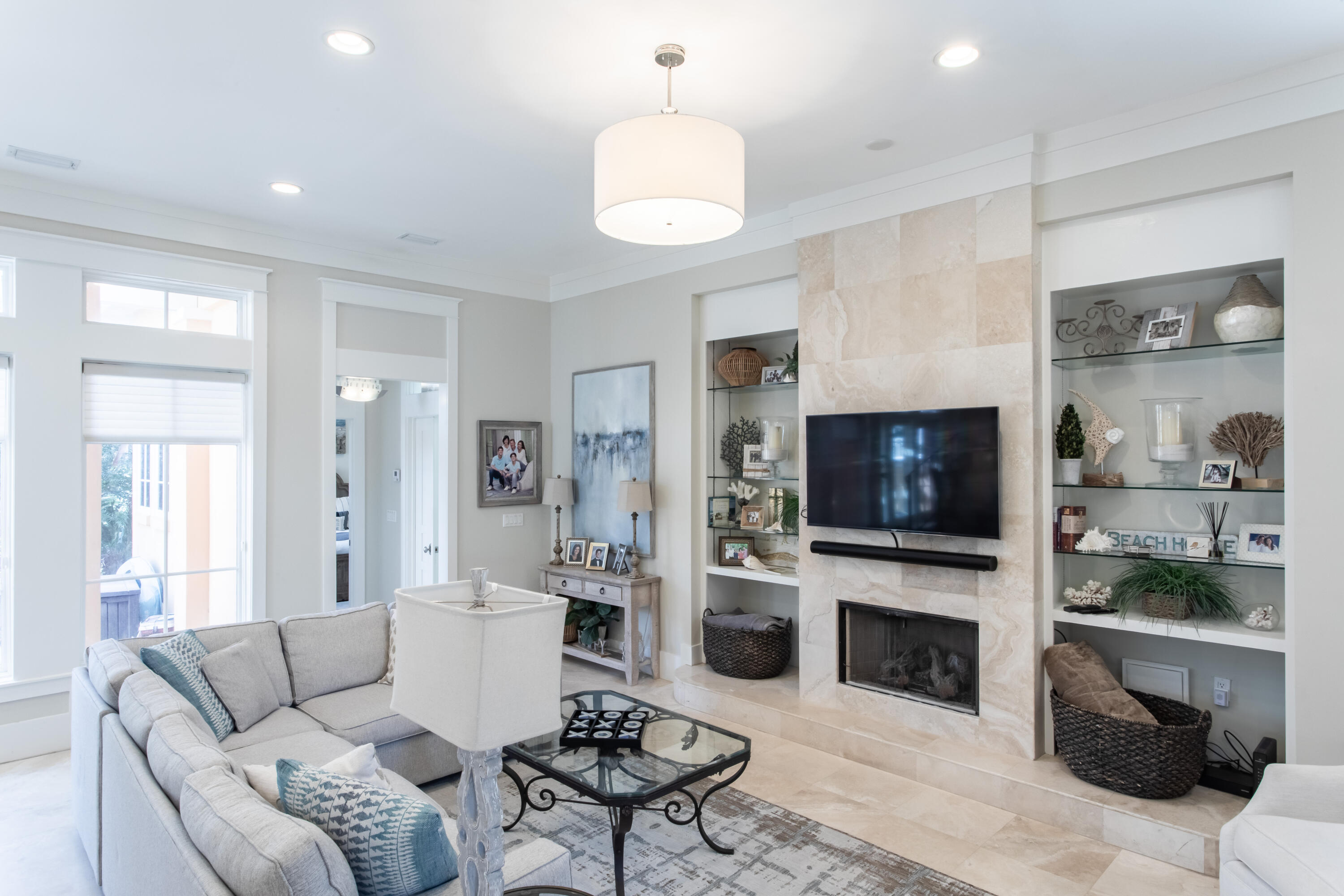 175 Rue Martine Miramar Beach, FL 32550 - Photo 4 of 23 a living room with furniture a fireplace and a flat screen tv