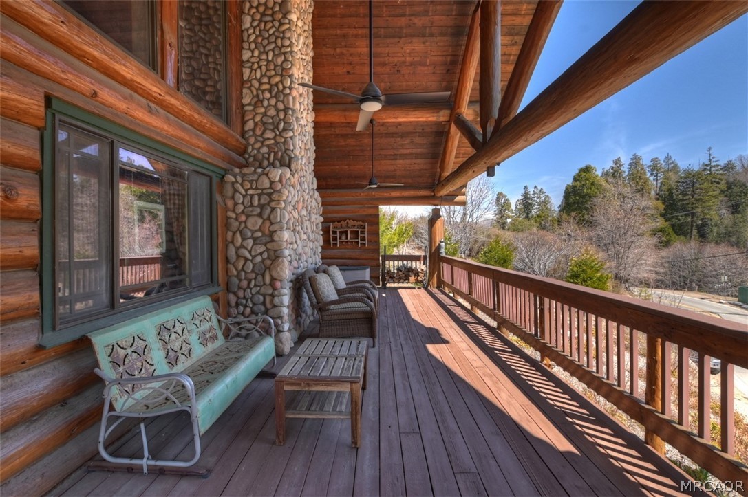29632 Hook Creek Road Cedar Glen, CA 92321 - Photo 34 of 43 a balcony with wooden floor and outdoor seating
