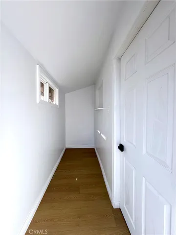 a view of a hallway with a white walls