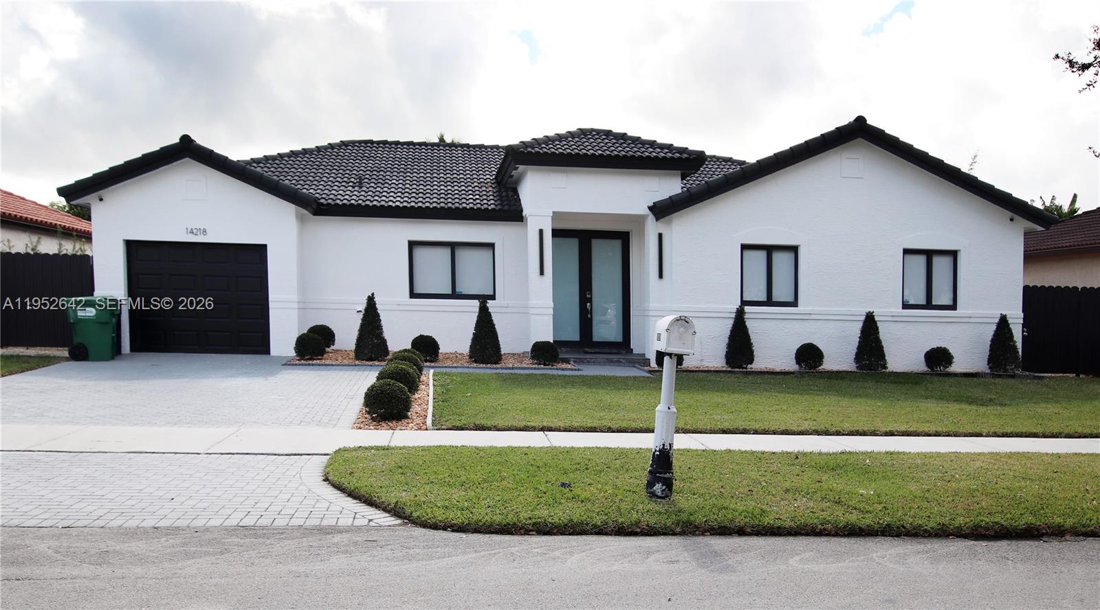 14218 Southwest 291st Street Homestead, FL 33033 - Photo 1 of 36 a front view of a house with a yard