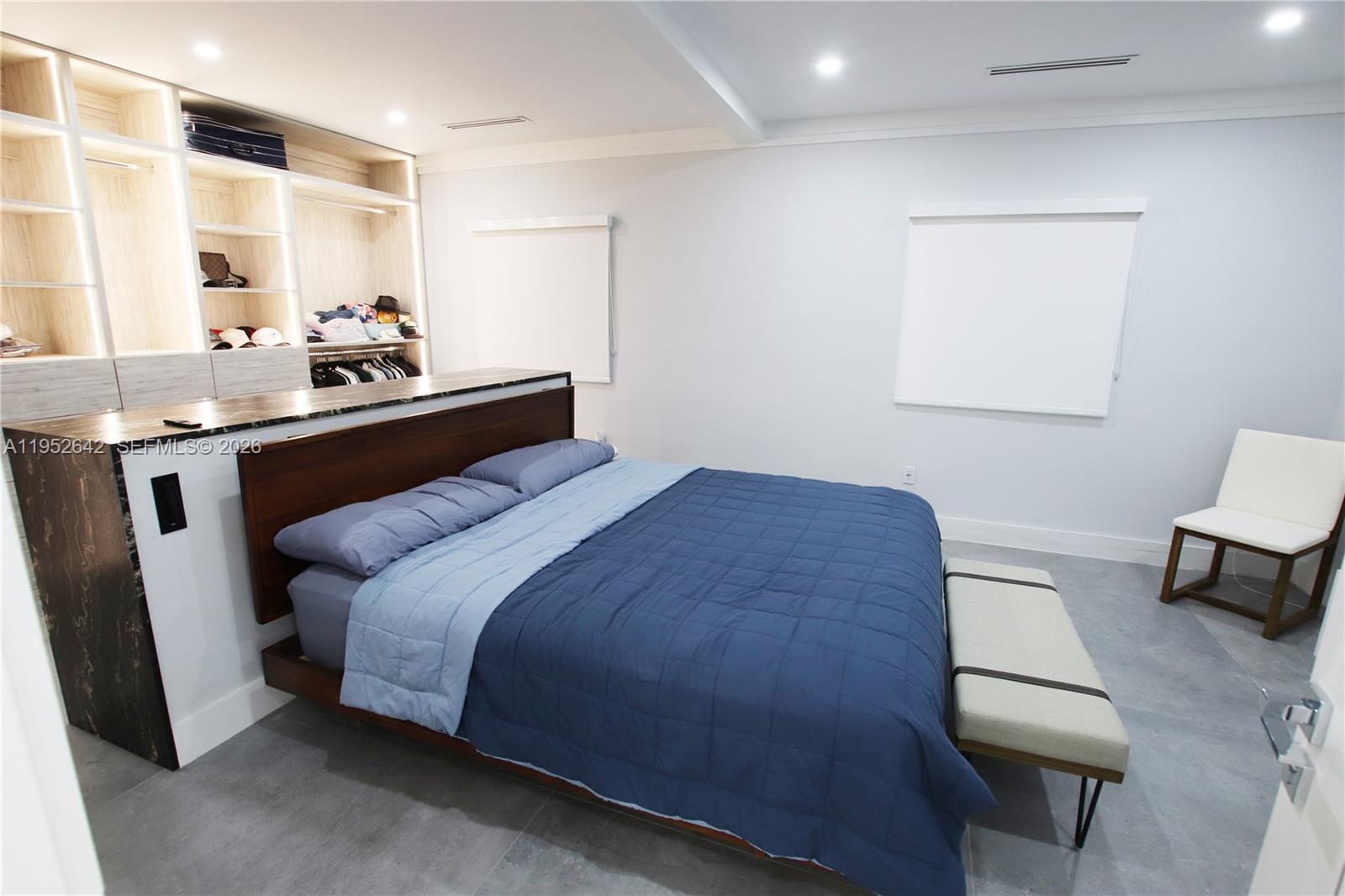 14218 Southwest 291st Street Homestead, FL 33033 - Photo 34 of 36 a bedroom with a bed and a table