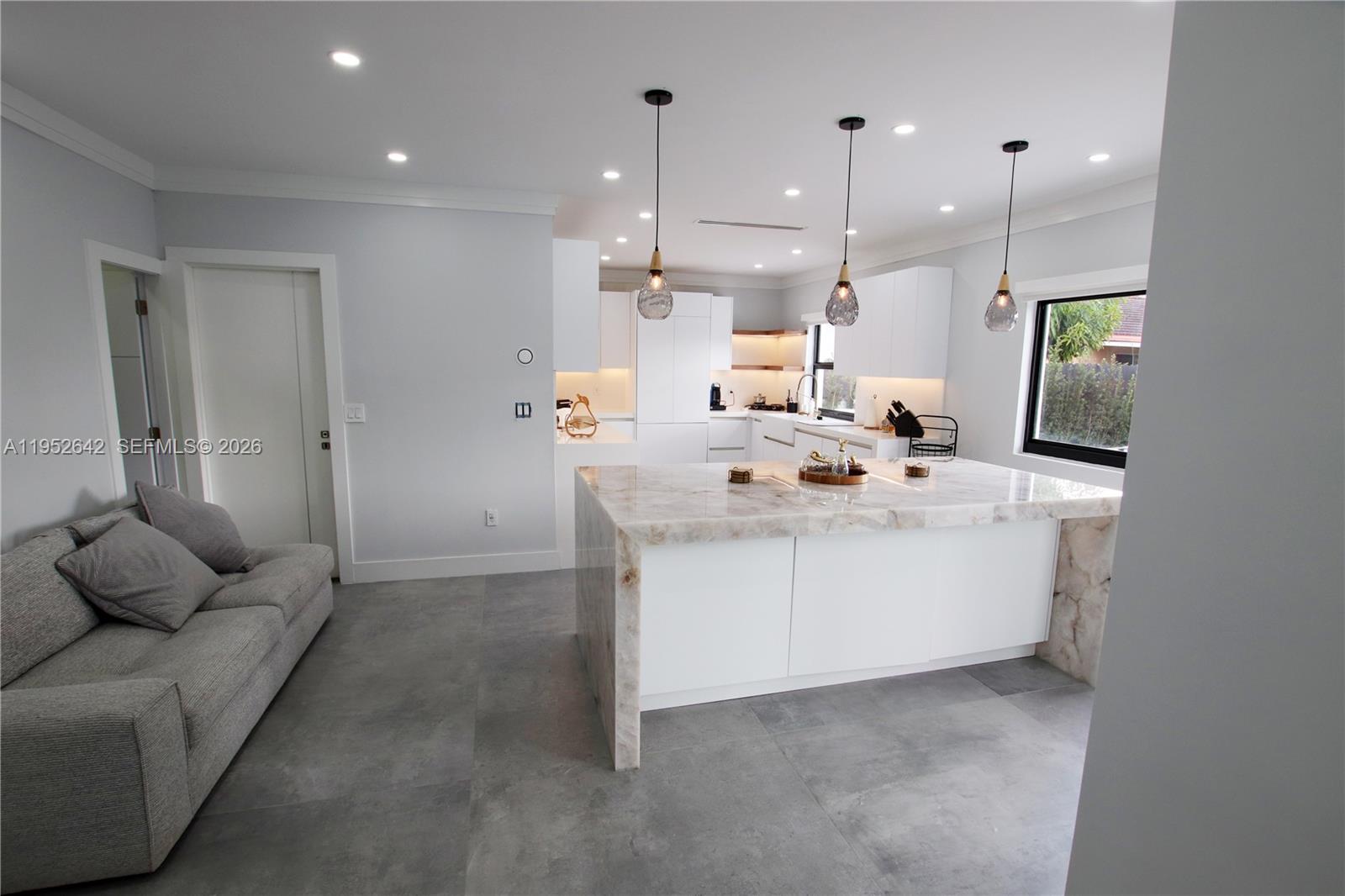 14218 Southwest 291st Street Homestead, FL 33033 - Photo 9 of 36 a bathroom with a sink a mirror and cabinets