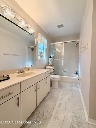 a tennis court with trees in the background