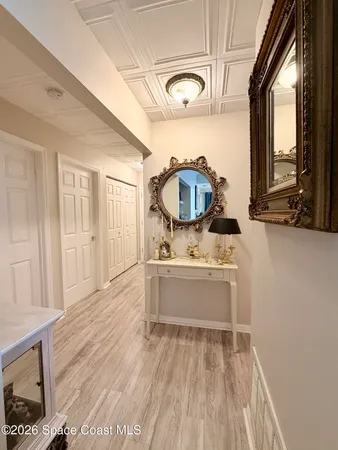 a view of a tennis ground with trees in the background