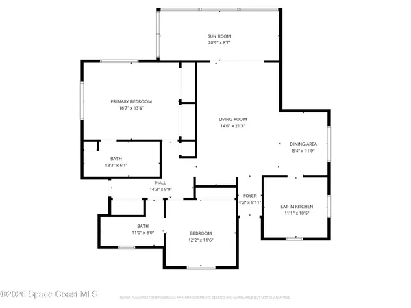 an aerial view of a city with lots of residential buildings ocean and mountain view in back