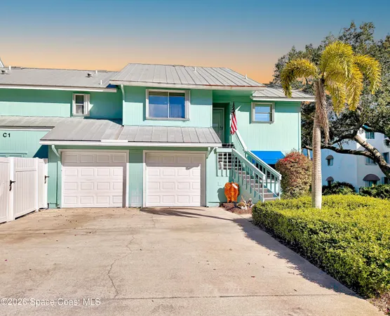 an aerial view of a city with ocean view