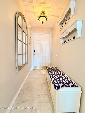 a kitchen with a refrigerator and a sink