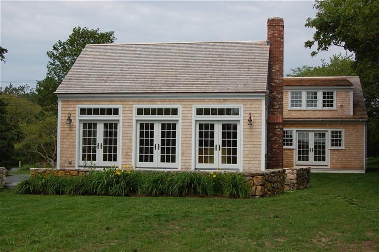 465 Stage Harbor Road Chatham, MA 02633 - Photo 3 of 17 front view of a house with a yard