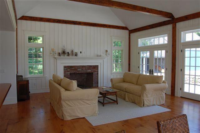 465 Stage Harbor Road Chatham, MA 02633 - Photo 6 of 17 a living room with furniture and a fireplace