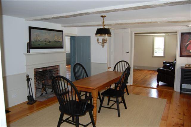 465 Stage Harbor Road Chatham, MA 02633 - Photo 7 of 17 a view of a a dining room with furniture window and wooden floor