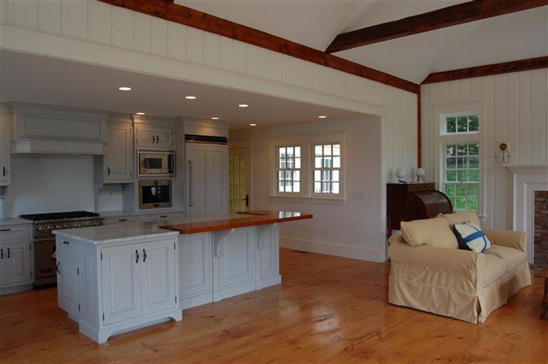 465 Stage Harbor Road Chatham, MA 02633 - Photo 8 of 17 a kitchen with stainless steel appliances granite countertop a sink a stove and a wooden floors