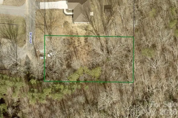 a view of a yard with trees