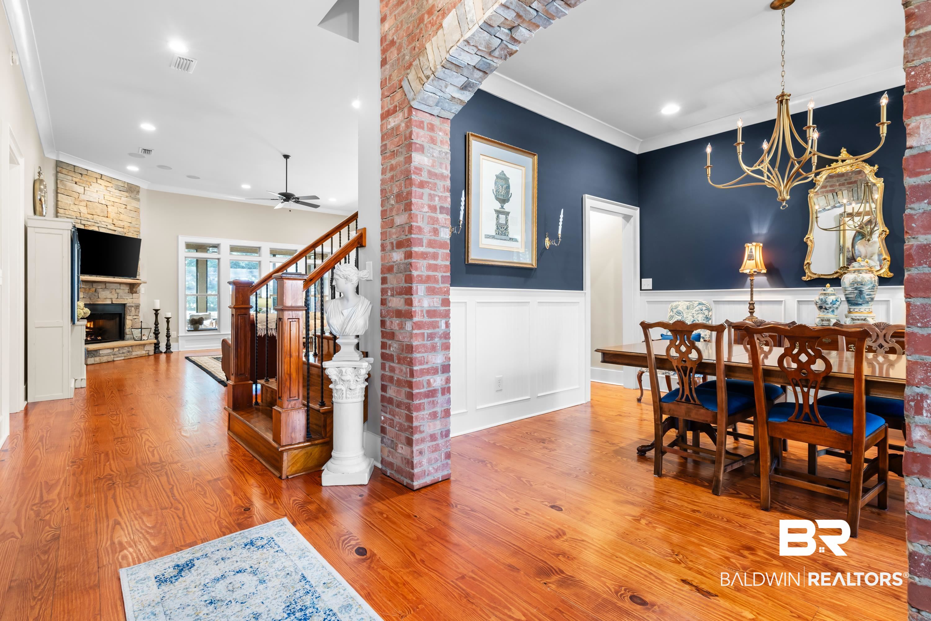 30057 Dolive Ridge Daphne, AL 36527 - Photo 5 of 55 Dining room with ceiling fan, light hardwood / wood-style flooring, crown molding, and a fireplace
