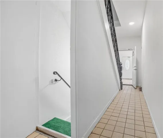 a view of a hallway view with staircase