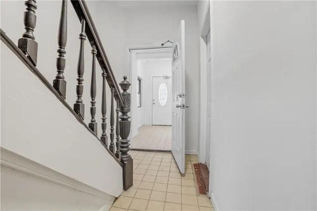 a view of staircase with wooden floor and a rug